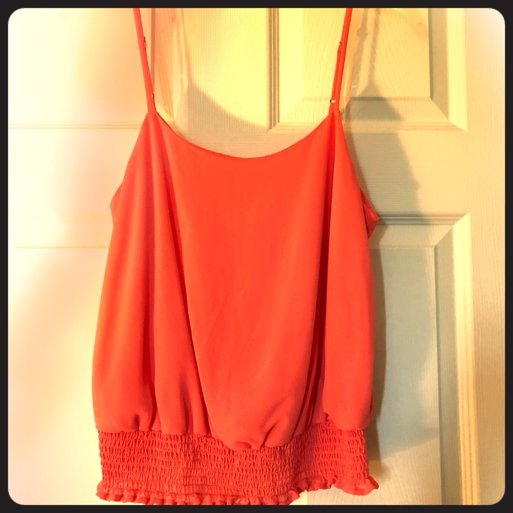 Never worn, dressy tank top. Soft, 100% polyester